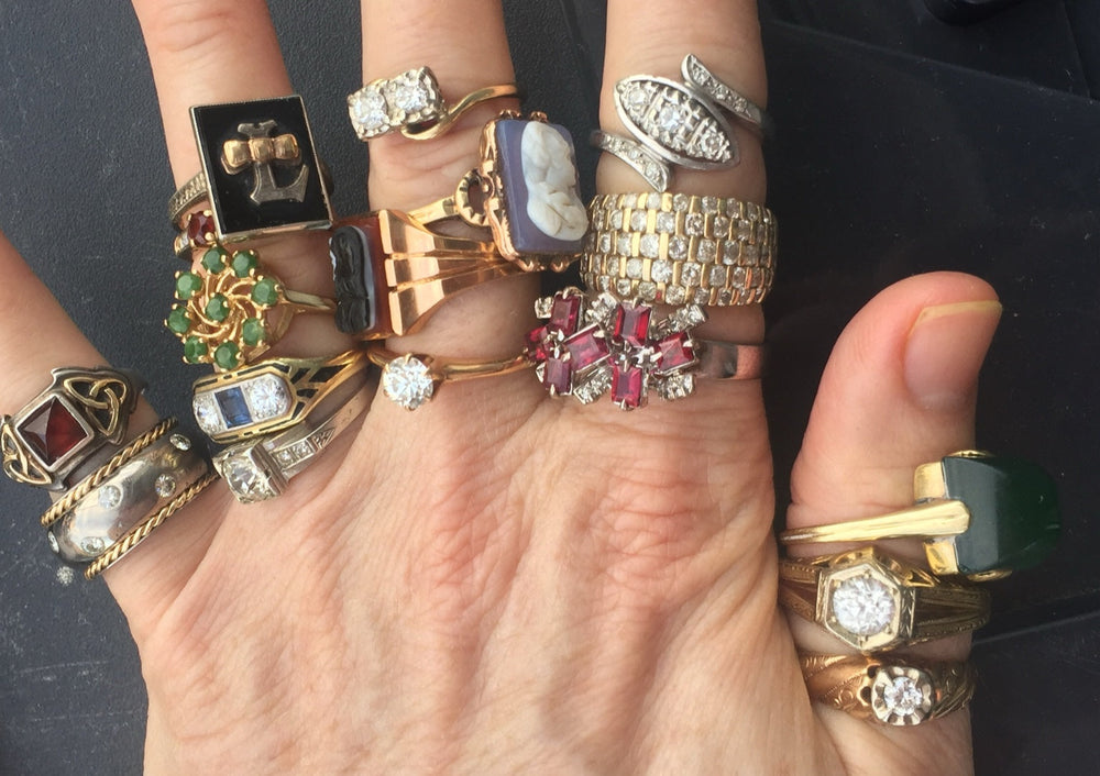 A secret gathering of vintage rings — each carrying its own love story, from family heirlooms to timeless treasures.