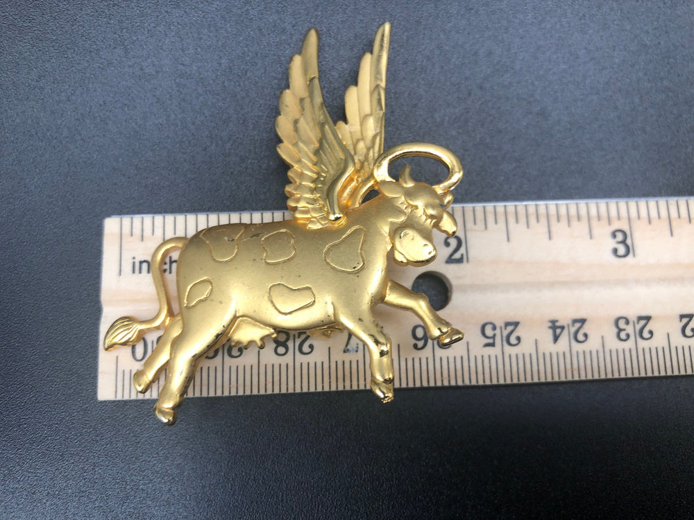 Cows cows cows! Cute cows goldtone Lot of 2 brooches One has articulated moving legs other is angel with wings + halo Designer JJ