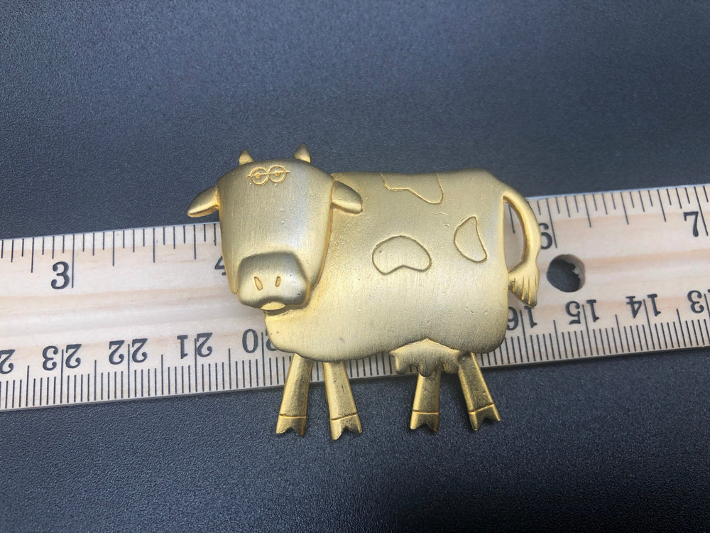 Cows cows cows! Cute cows goldtone Lot of 2 brooches One has articulated moving legs other is angel with wings + halo Designer JJ